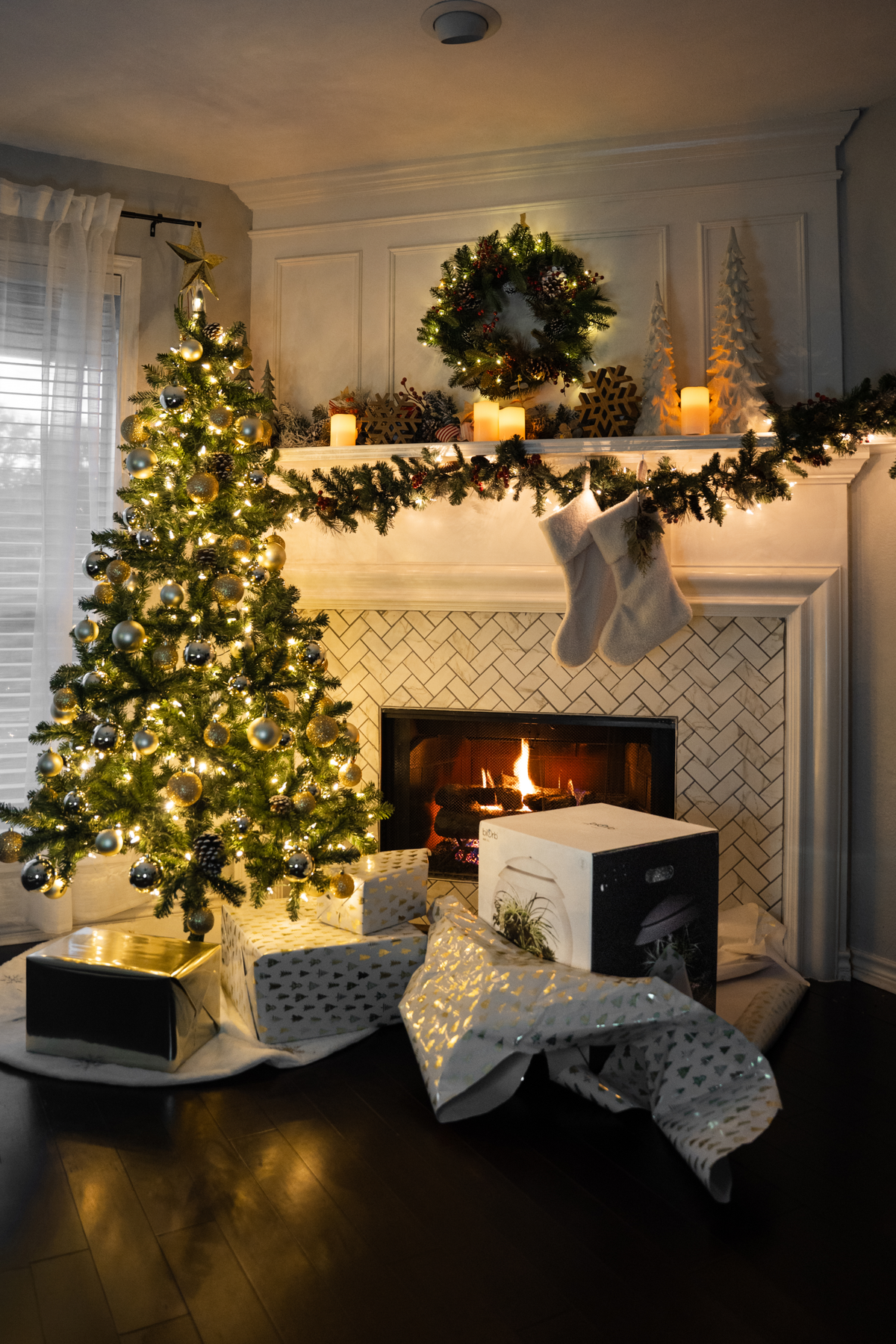 biOrb AIR 30 terrarium in gift wrapping next to a Christmas tree - great gift for plant lovers